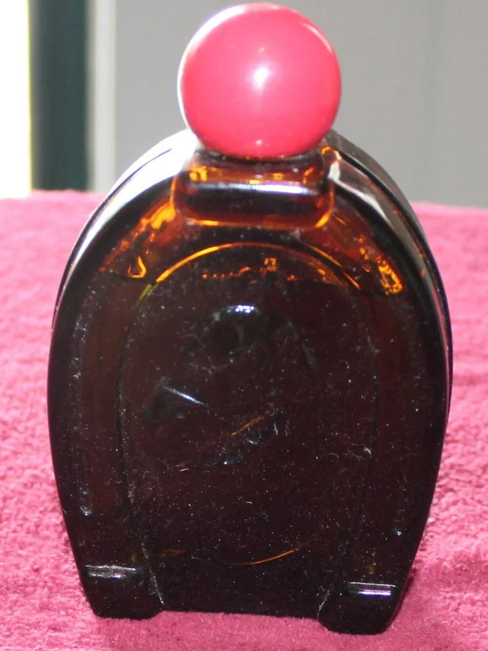 Vintage Avon horseshoe-shaped bottle designed for men's aftershave